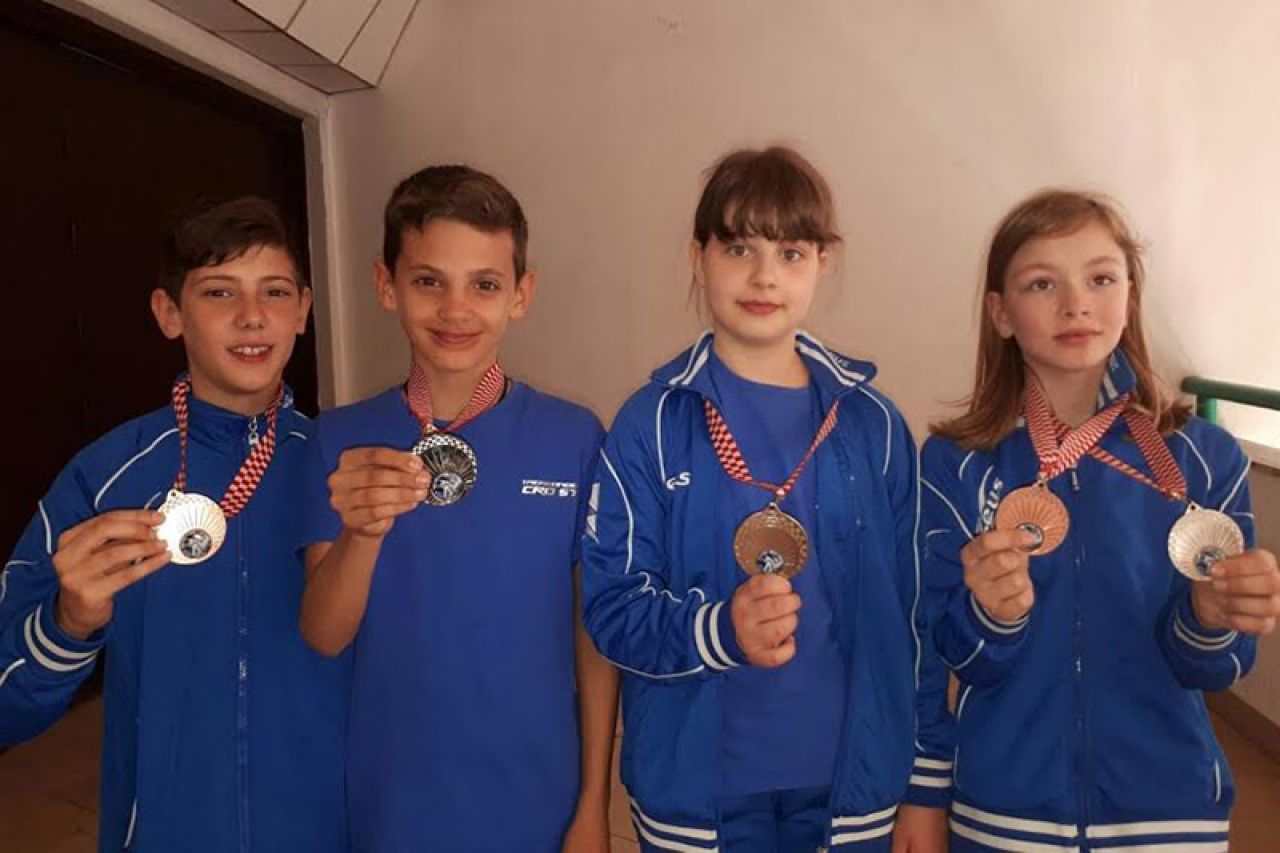 S četiri natjecatelja osvojili pet medalja